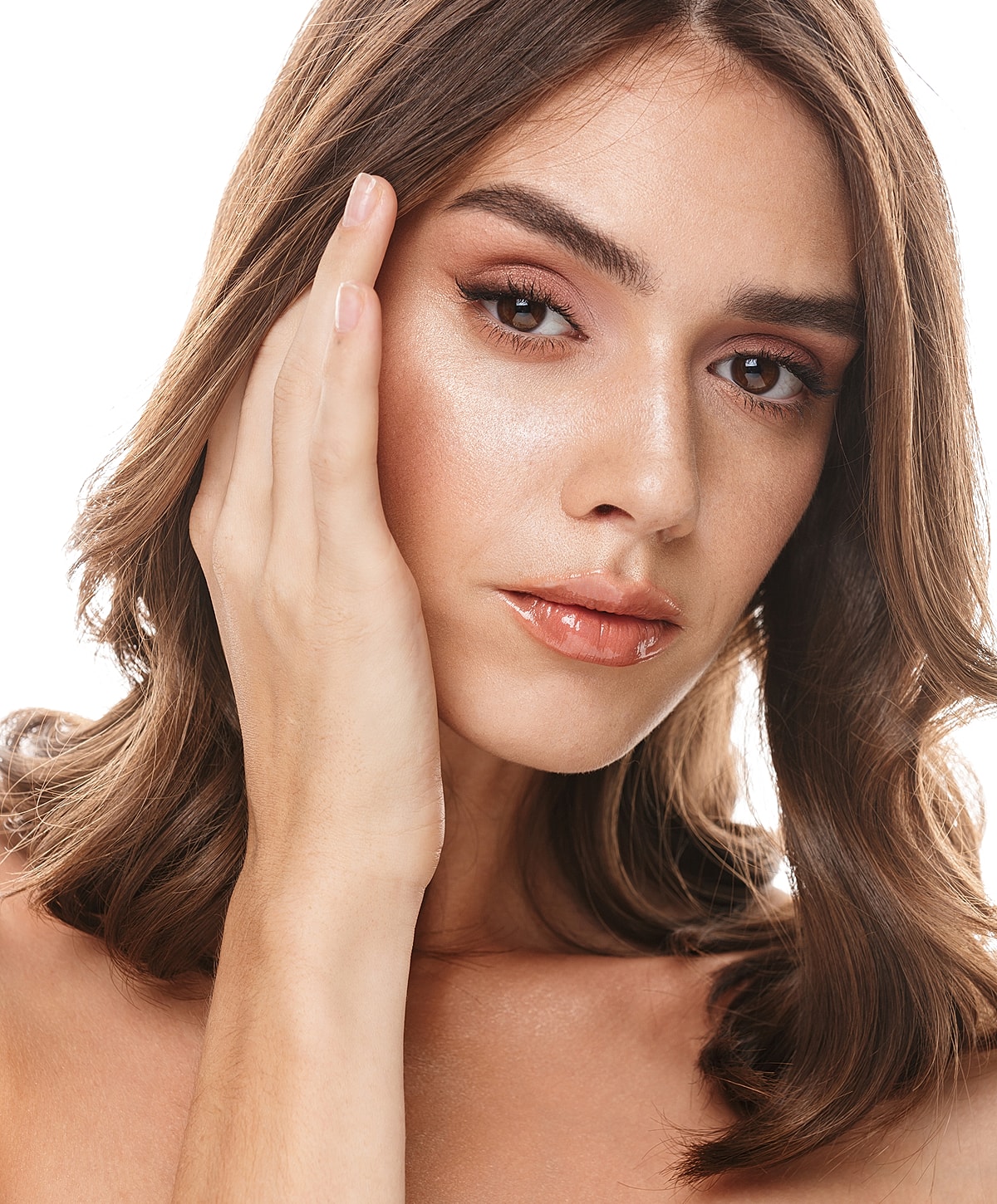 Model posing with hands raised and closed eyes.