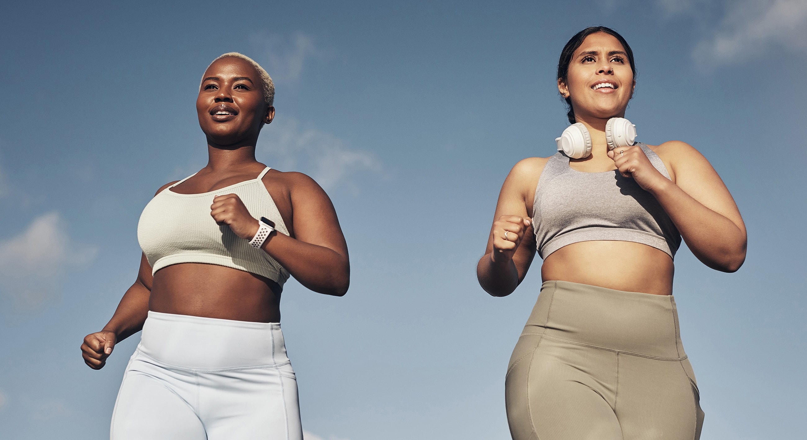 Women jogging outdoors, active and healthy lifestyle.