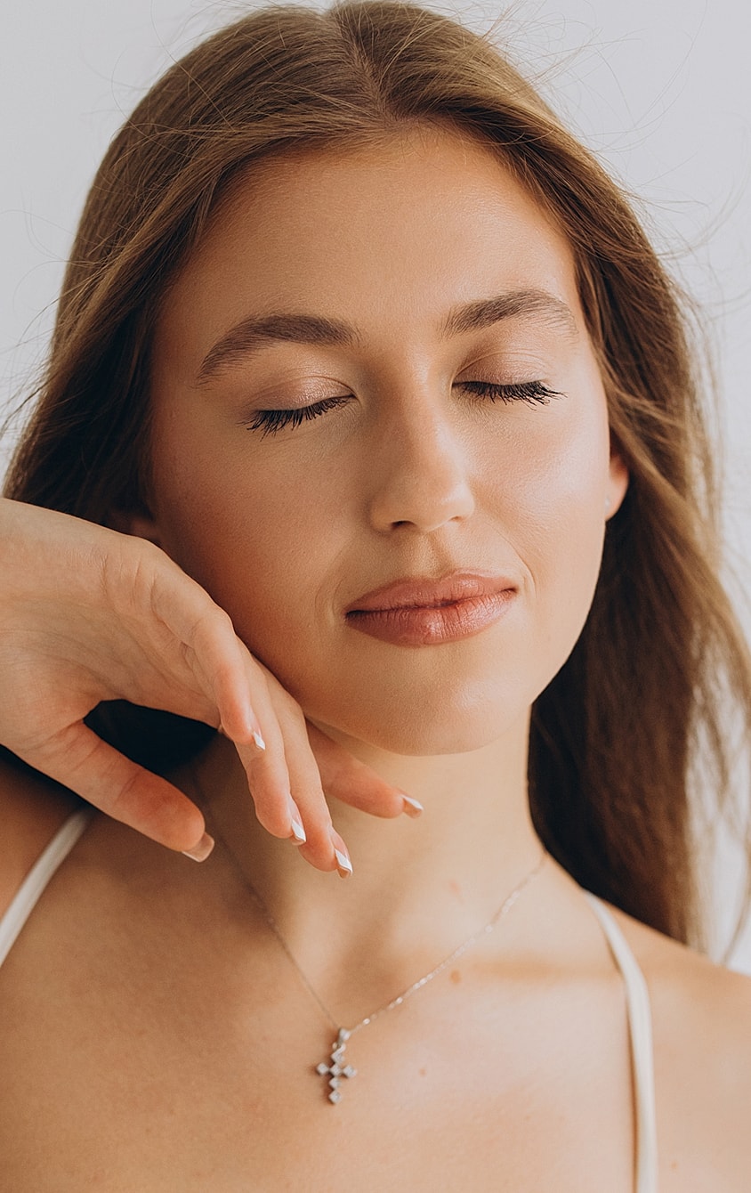 Woman with closed eyes and serene expression.